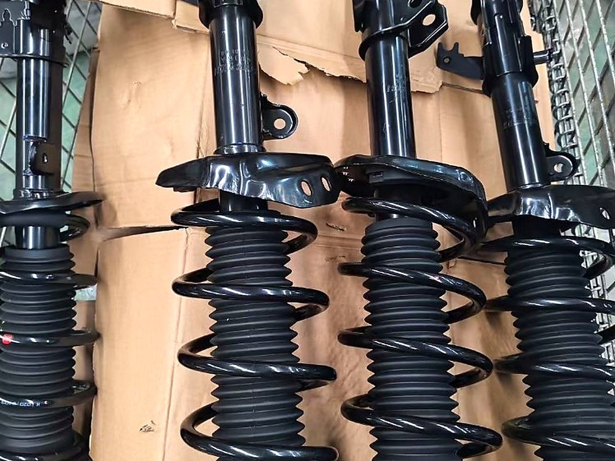 Complete strut assemblies with coil springs inspected before export packing