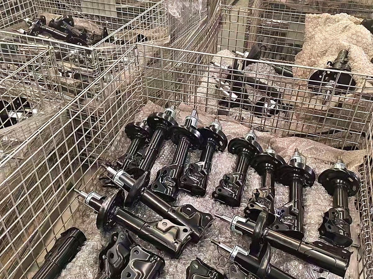 Shock absorber struts in warehouse storage awaiting consolidation