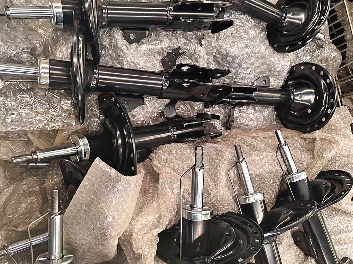 Shock absorber struts and complete strut assemblies packed for shipment to the United States